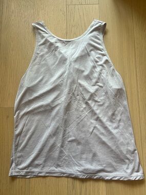 Lululemon light pastel purple tank with cross cross detail in back, size 4